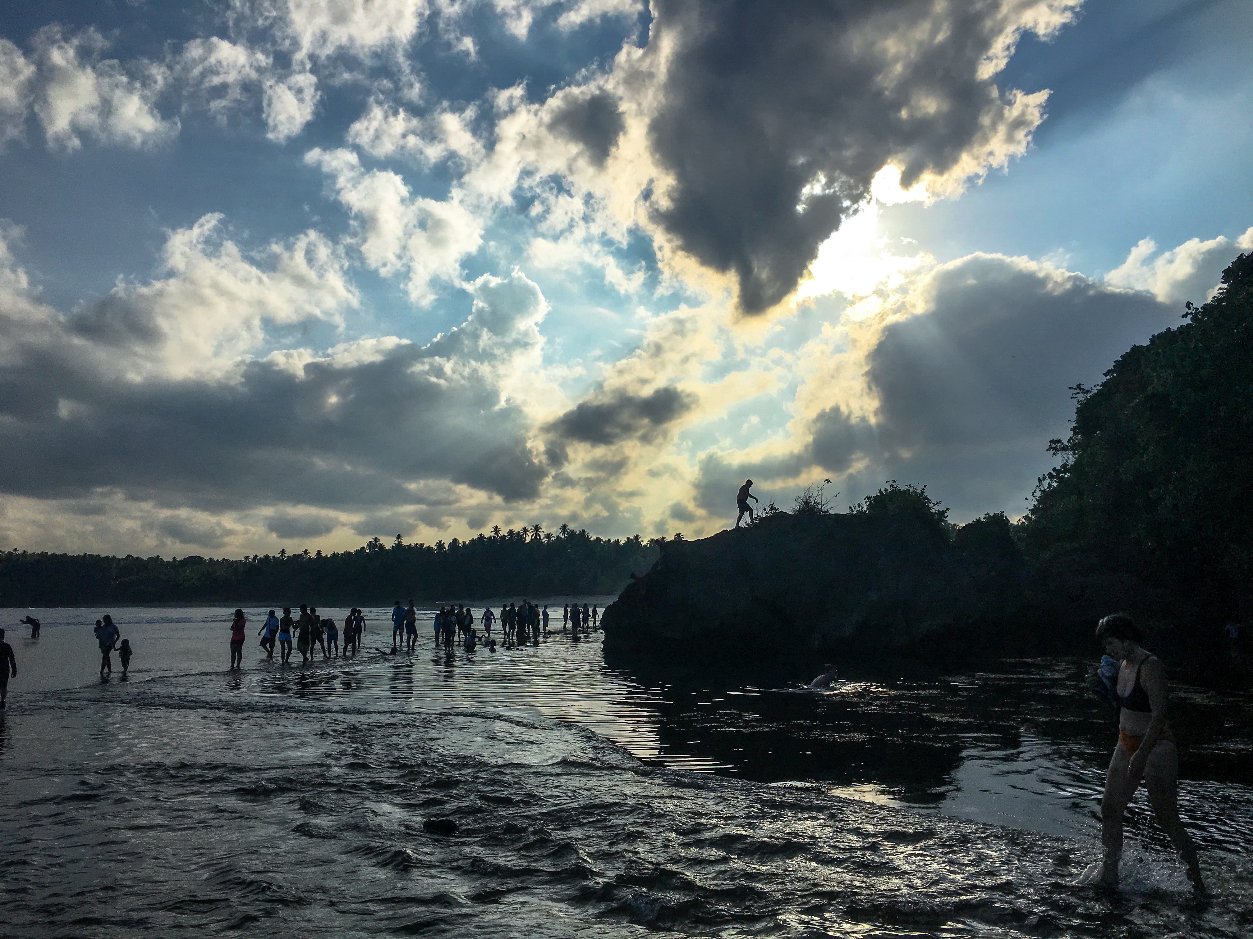 people enjoying at magpupungko tidal rock pools at siargao island